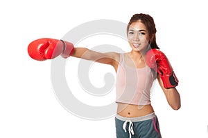 Asian slim girl punch with red boxing glove