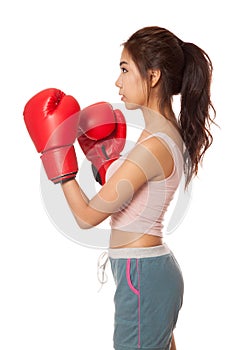 Asian slim girl with red boxing glove