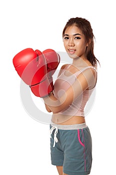 Asian slim girl with red boxing glove