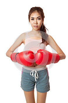 Asian slim girl with red boxing glove