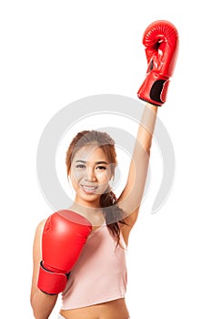 Asian slim girl win the fight with red boxing glove