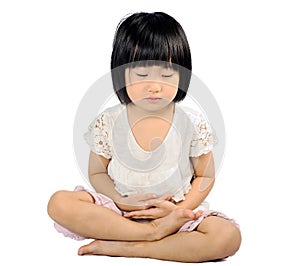 Asian small child doing meditation in buddhism practice