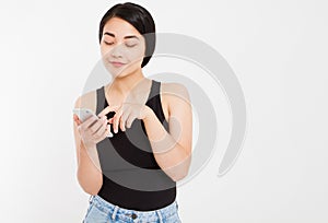 Asian smile girl using cellphone isolated on white background