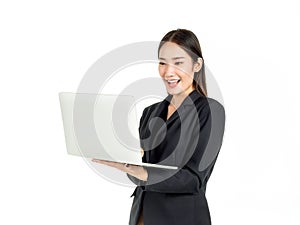 Asian smiling business women wearing suit using laptop computer isolated on white background