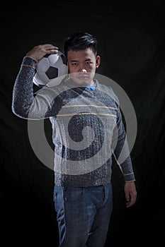 Asian soccer mania man on black photo