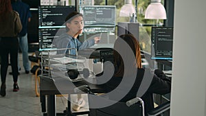 Asian software developer with impairment writing code with html script in data room