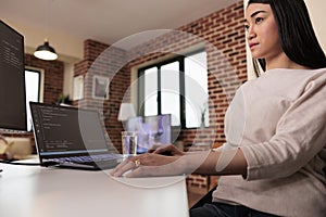 Asian software developer using terminal window