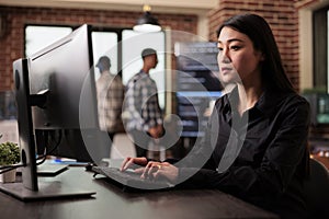 Asian software developer working with html script on terminal window
