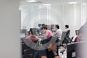 Asian Software Developers Office Team Sitting At Desk