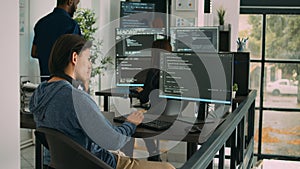 Asian software engineer working on security program with server code