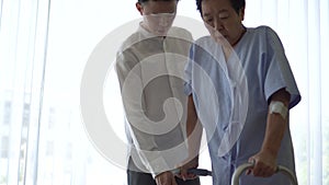 Asian son help mom do walking physical theraphy after accident