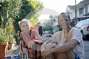 asian son and old mother happiness with relaxing time at home village