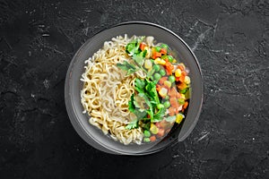 Asian soup with noodles and vegetables in a bowl, with toast bread. Dietary food.