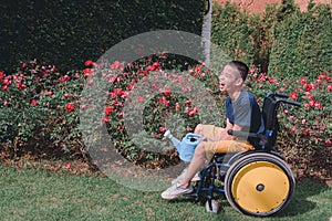Asian special child on wheelchair doing activity on the outdoor, Earth day concept