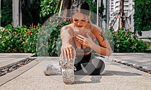 Asian sport girl doing stretching, yoga fitness and plank exercise outside. Fit young thai woman doing training workout