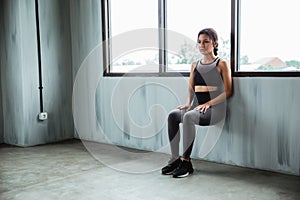 Asian sportswoman doing workout for endurance power legs