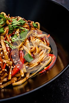 Asian Stir-Fried Noodles with Vegetables and Sesame Seeds photo