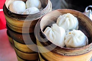 Asian street food concept, Chinese steamed pork buns. Chinese breakfast. chinese steamed bun in traditional bamboo steamer