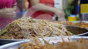 Asian Street food. Fried rice noodles traditional and popular dish in Asia. Closeup. 4k