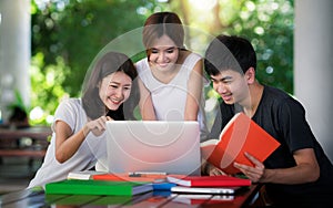 Asian student do report and home work togather