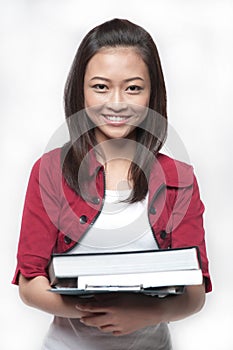 Asian Student holding books 3