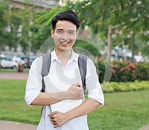 Asian student with laptop