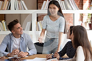 Asian student lead group meeting of multi-ethnic schoolmates