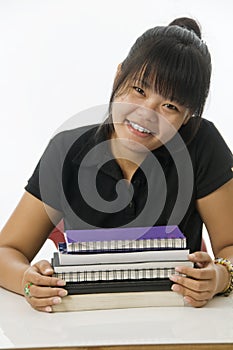 Asian student with notebooks