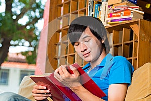 Asian student reading book or textbook learning