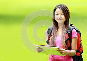 Asian student smiling on park