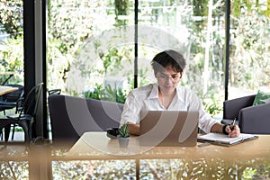 Student using computer for learning leasson online at cafe. star