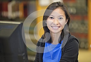 Asian student working at computer photo