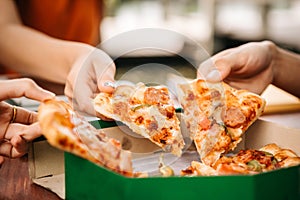 Asian students eating eating the pizza together