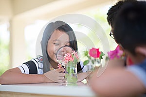 Asian Students and teach study biology scicence in outdoor classroom