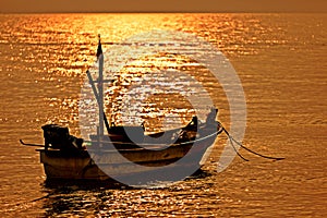 Asian style boat at sunset