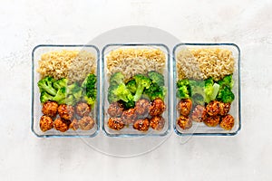 Asian style chicken meat balls with broccoli and rice in a take
