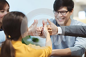Asian successful business people teamwork hand showing thumbs up, business concept