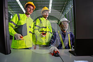 Asian Supervisor engineer Consult with warehouse workers, Inside the Heavy Industry Factory male Industrial Engineer Works on