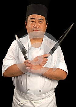 Asian sushi chef with his knives photo