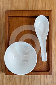 White cup and spoon on tray