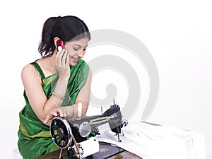 Asian tailor her cell phone