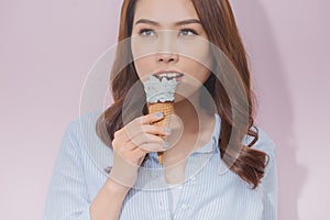 Asian Tan Skin Girl holding Icecream cone in her mouth