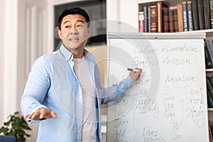 Asian Teacher Man Teaching Having English Class In Modern Classroom