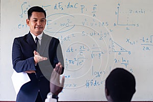 Asian teacher teaching science in the classroom
