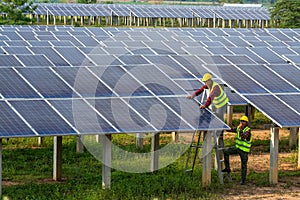 Asian team electrician installing solar panels working on alternative energy sources clean, Solar Power