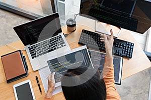 .Asian team Outsource Developer Looking Screen Programming Code Working with Laptop Computer Software