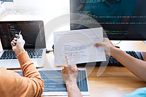 Asian team Outsource Developer Looking Screen Programming Code Working with Laptop Computer Software