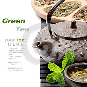 Asian teapot with green tea selection