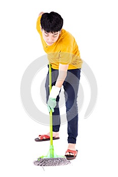 Asian teen boy cleaning floor with mop. Young child doing house chores isolated on white background