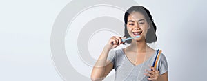 Asian teen facial with braces smiling to camera to show orthodonic teeth